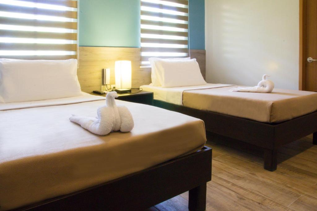 Postel nebo postele na pokoji v ubytování Sheridan Boutique Hotel
