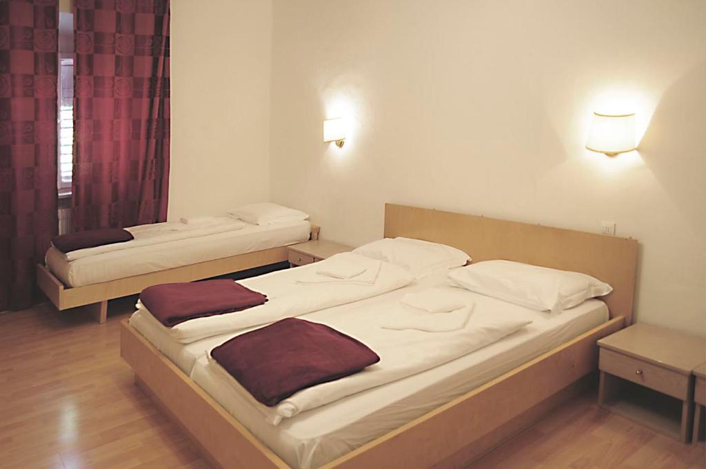 Posteľ alebo postele v izbe v ubytovaní Albergo Casagrande