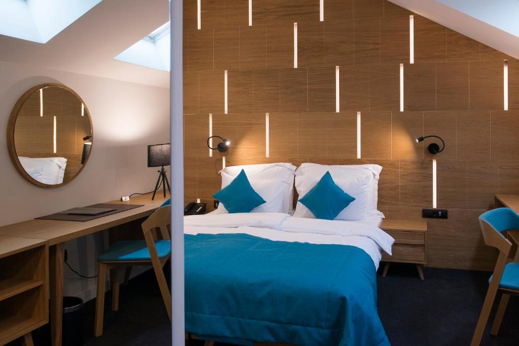 Postel nebo postele na pokoji v ubytování Hotel Sana