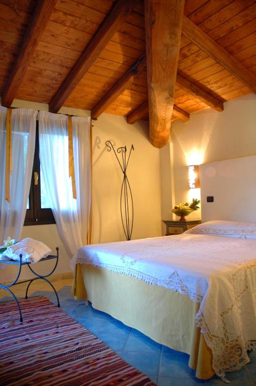 Postel nebo postele na pokoji v ubytování Hotel Su Lithu
