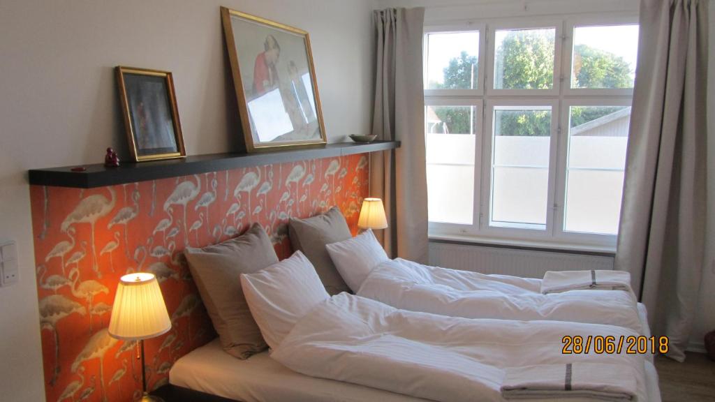 Postel nebo postele na pokoji v ubytování Årslev B&B