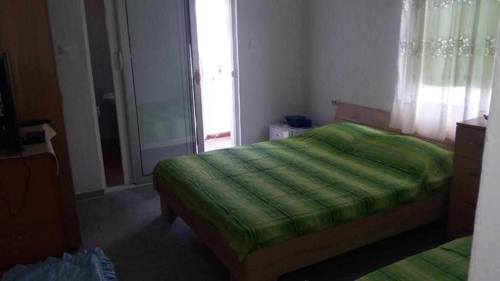 Postel nebo postele na pokoji v ubytování Rooms Sijak