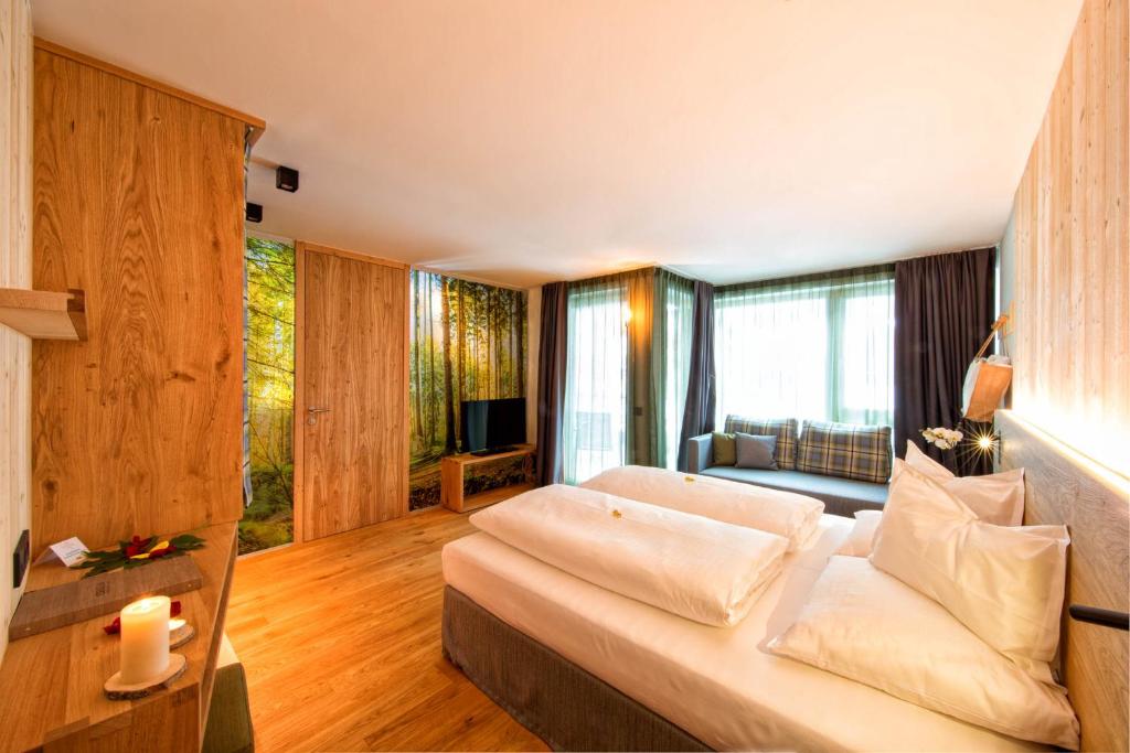 Postel nebo postele na pokoji v ubytování Mountain Design Hotel EdenSelva