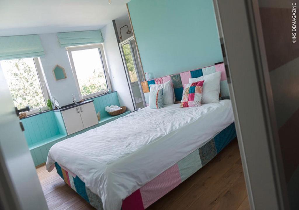 Un ou plusieurs lits dans un hébergement de l'établissement Maison Jules