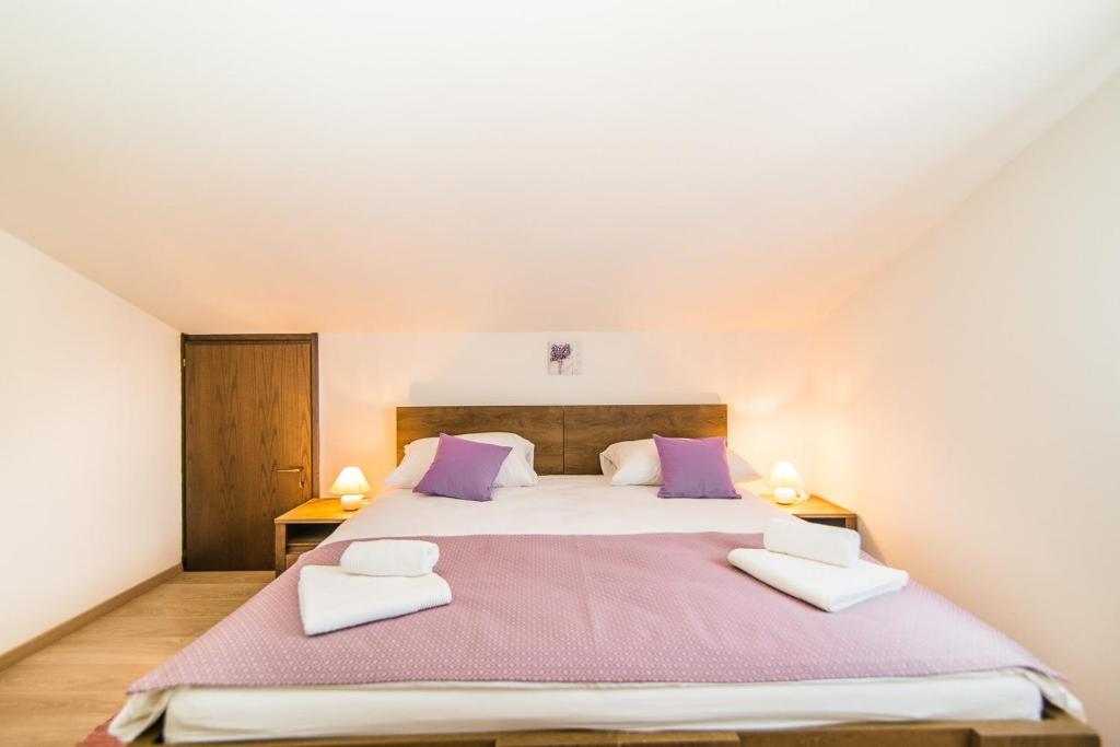 Postel nebo postele na pokoji v ubytování Apartments Dino