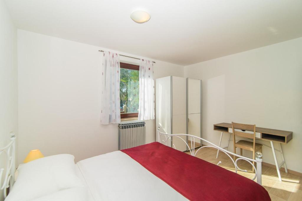 Postel nebo postele na pokoji v ubytování Apartments Dino