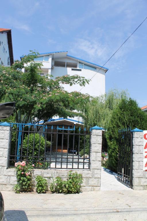 a gate in front of a building at Hotel Vila Alex in Costinesti