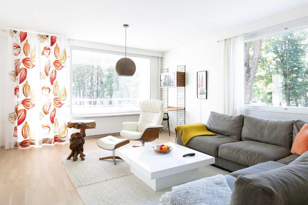 a living room with a couch and a coffee table at Design Apartments Kristiina in Naantali