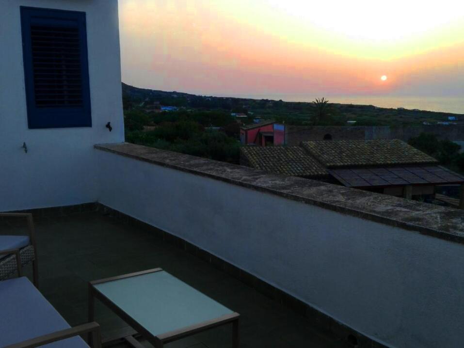 a view of a sunset from a balcony of a building at Belvedere Tramontana in Ustica