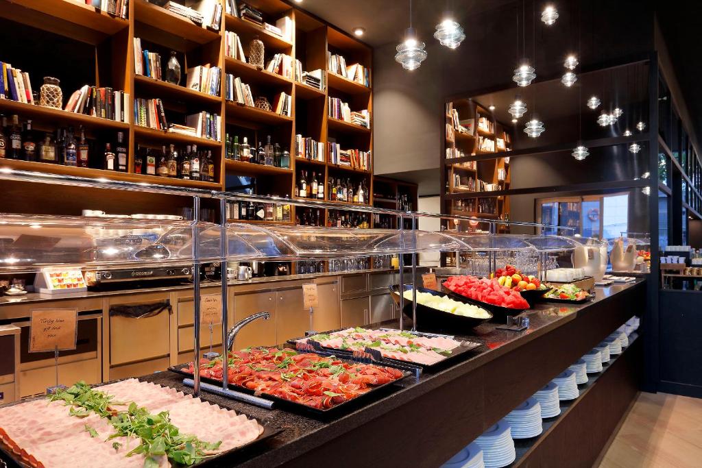 a buffet line with many different types of food at Hotel SB Icaria in Barcelona