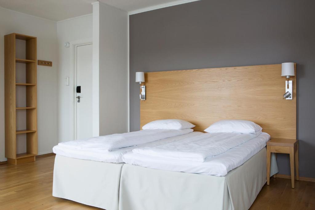 En eller flere senger på et rom på Comfort Hotel Fosna
