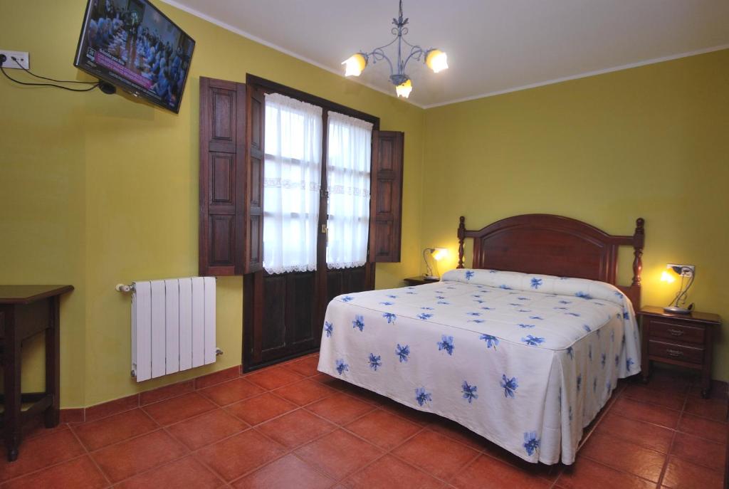 Cama o camas de una habitación en Hotel Los Ángeles