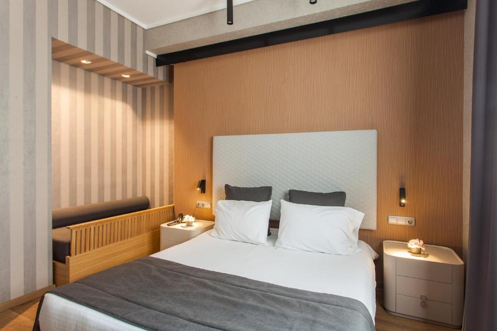 Łóżko lub łóżka w pokoju w obiekcie Egnatia Palace Hotel & Spa
