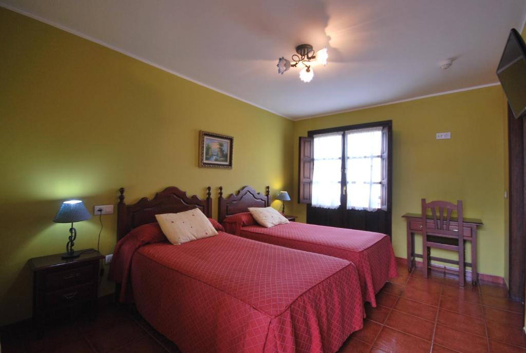 Cama o camas de una habitación en Hotel Los Ángeles