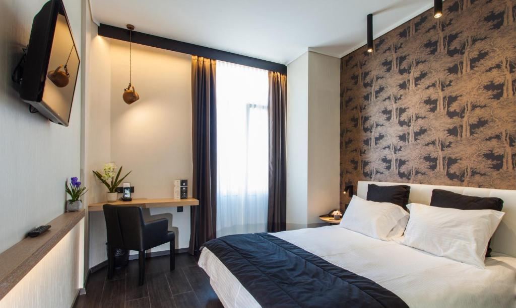 Łóżko lub łóżka w pokoju w obiekcie Egnatia Palace Hotel & Spa