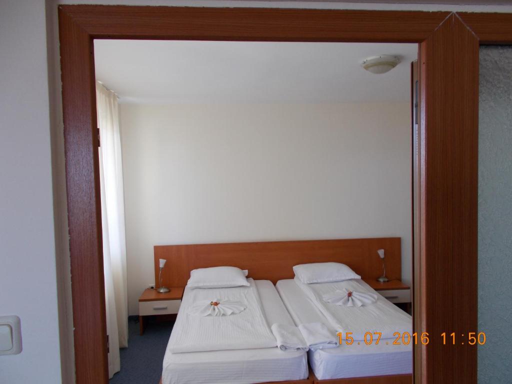 Postel nebo postele na pokoji v ubytování Family Hotel ATLAS