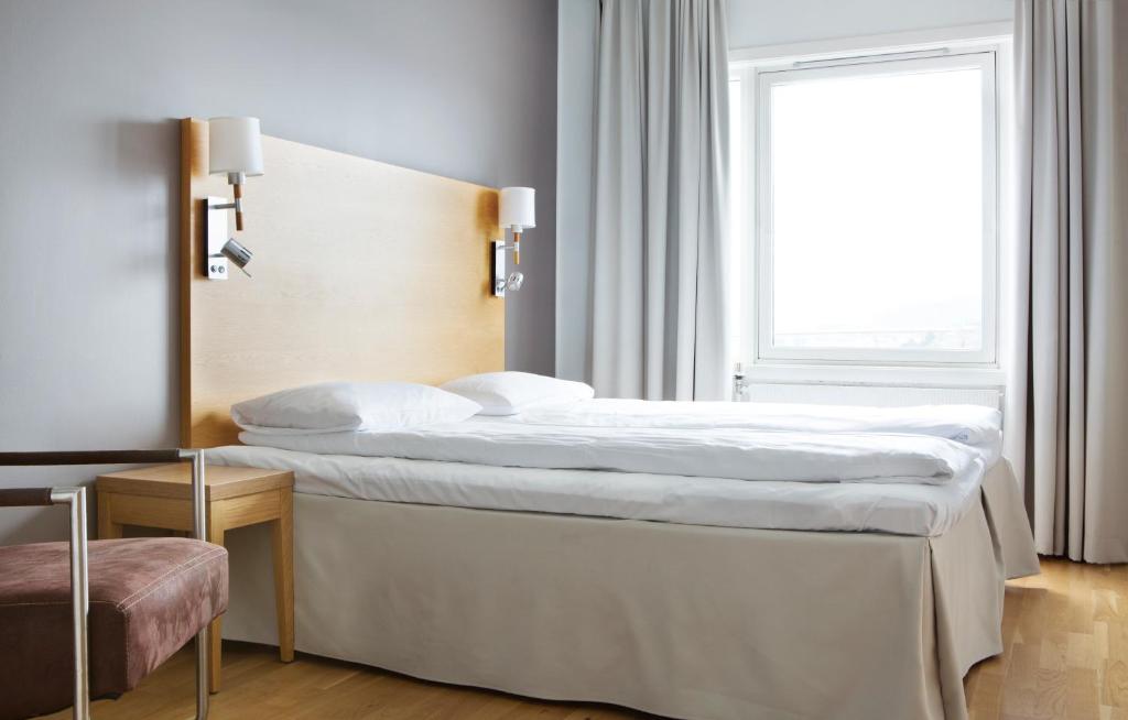 En eller flere senger på et rom på Comfort Hotel Fosna