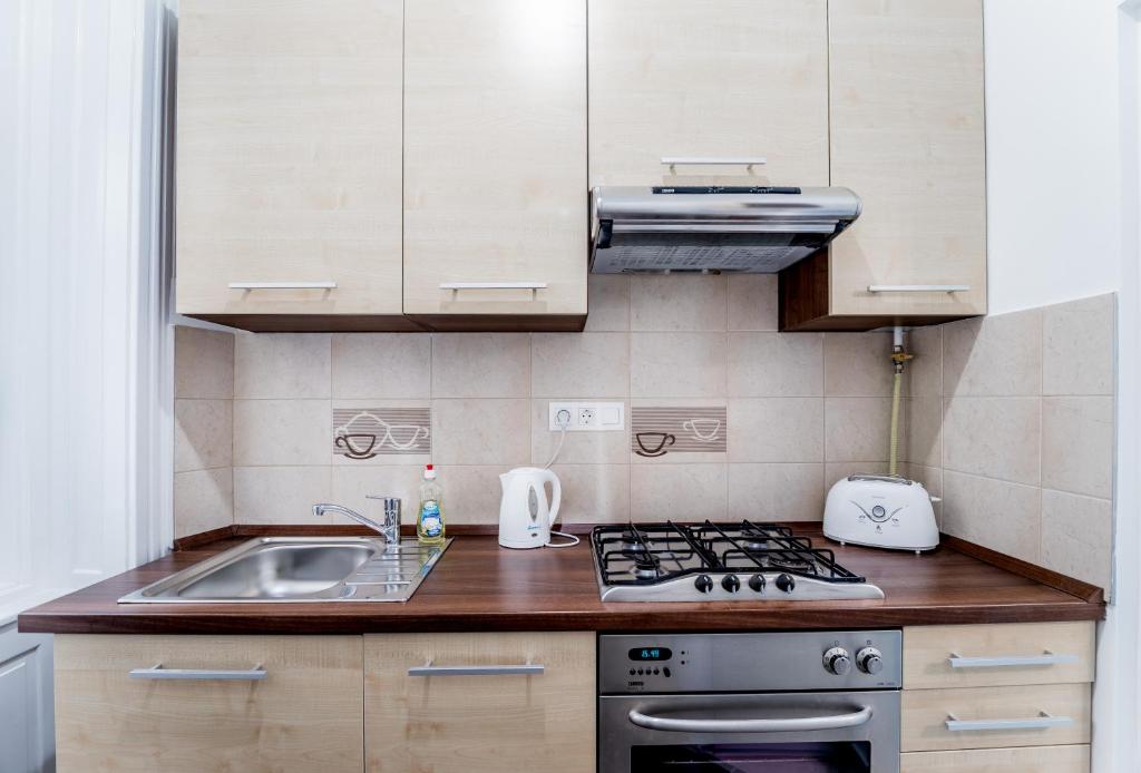 A kitchen or kitchenette at BpR Turquoise Simplicity Apartment