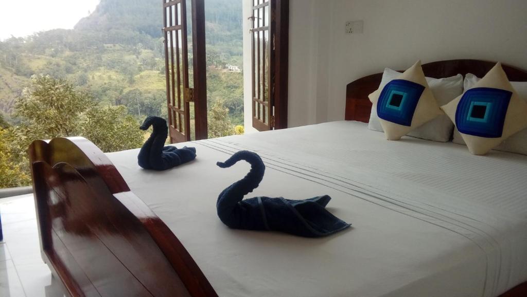 Postel nebo postele na pokoji v ubytování Daban Homestay Ella