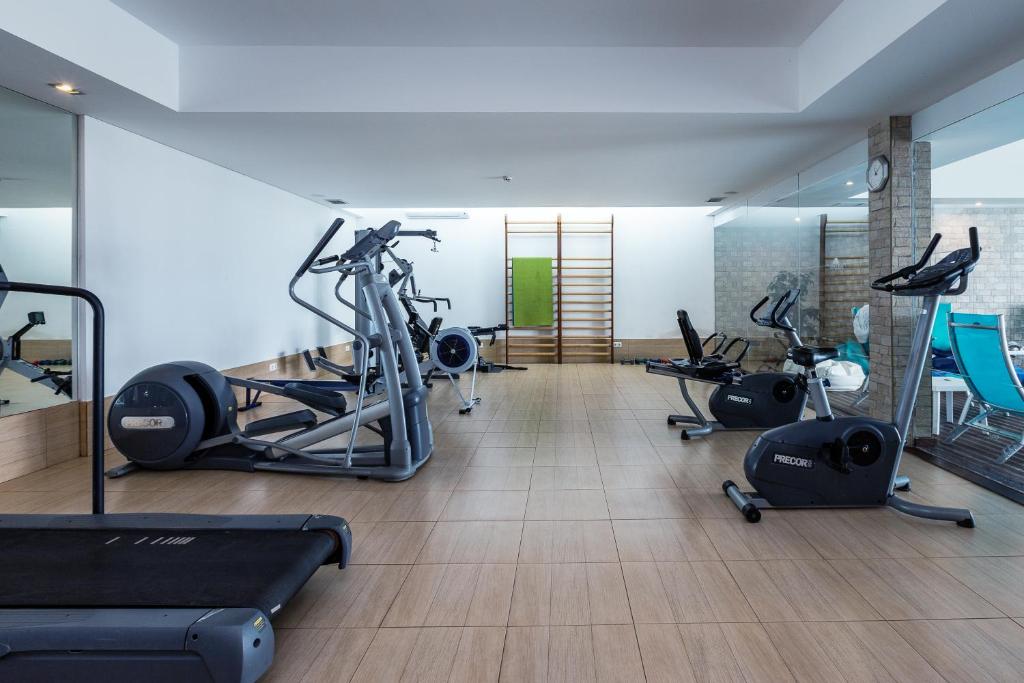 a gym with several exercise bikes in a room at Vila Alba Resort in Carvoeiro