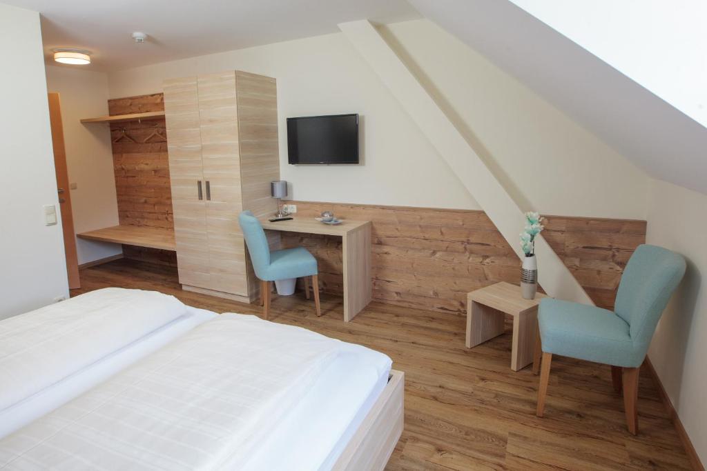 TV a/nebo společenská místnost v ubytování Pension Pirkdorfer See