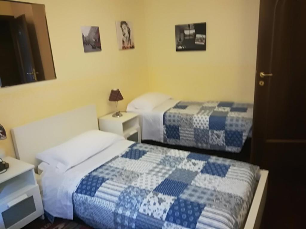 Posteľ alebo postele v izbe v ubytovaní B&B L'Isola di Casa