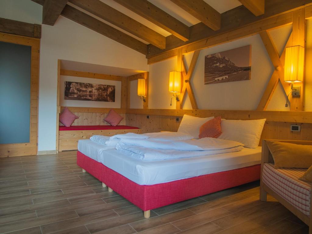 Postel nebo postele na pokoji v ubytování RTA Hotel Le Vallene