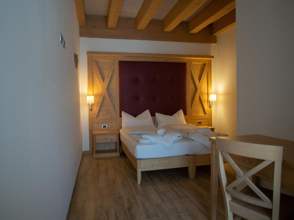 Postel nebo postele na pokoji v ubytování RTA Hotel Le Vallene