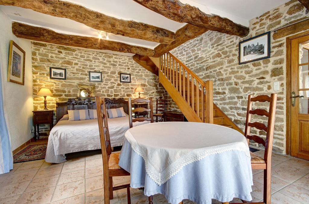 Postel nebo postele na pokoji v ubytování A la Ferme de Kervihern