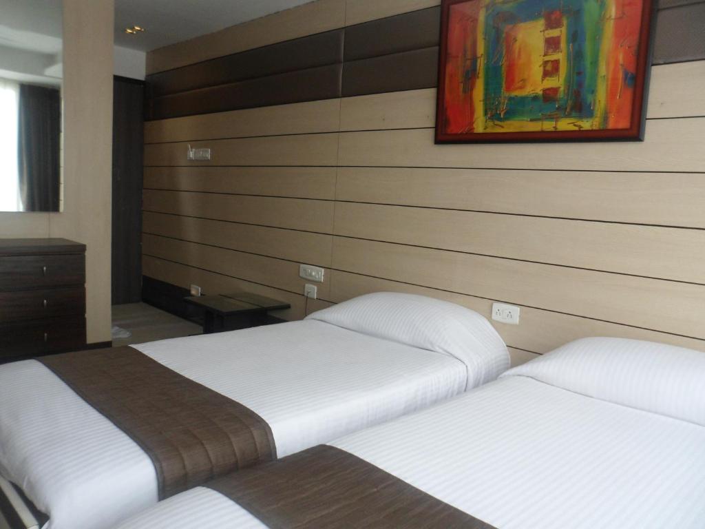 Postel nebo postele na pokoji v ubytování Hotel Esteem