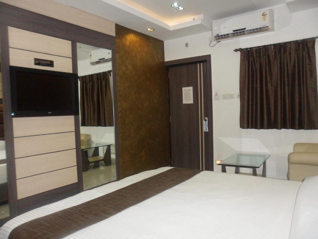 Postel nebo postele na pokoji v ubytování Hotel Esteem
