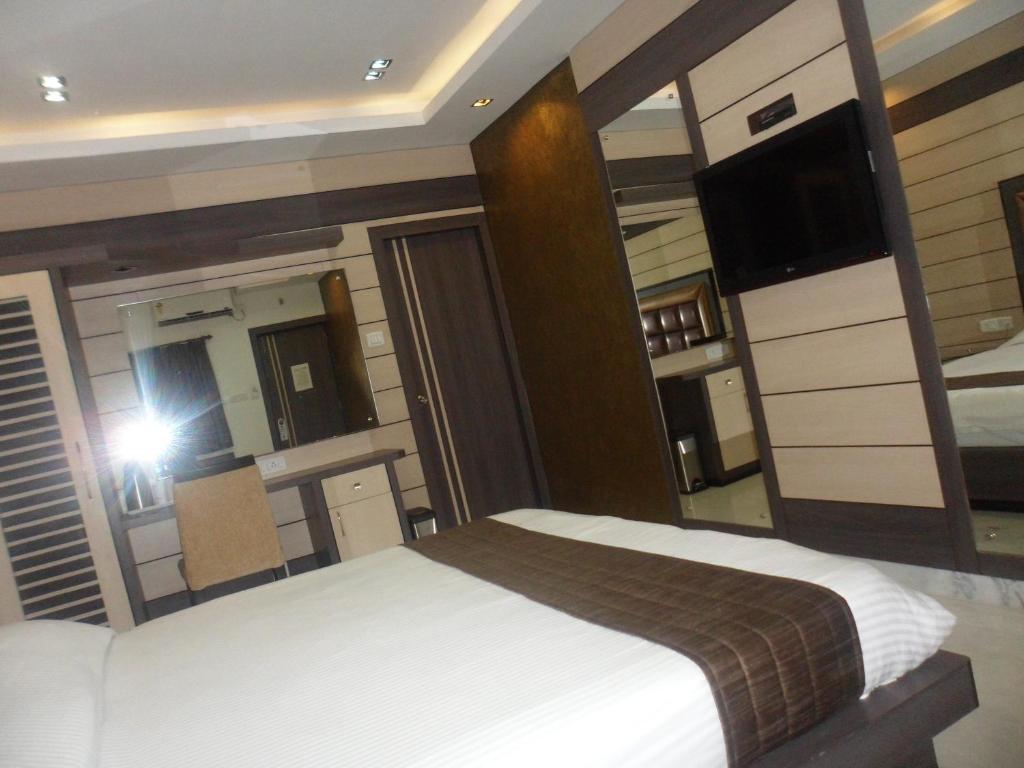 Postel nebo postele na pokoji v ubytování Hotel Esteem