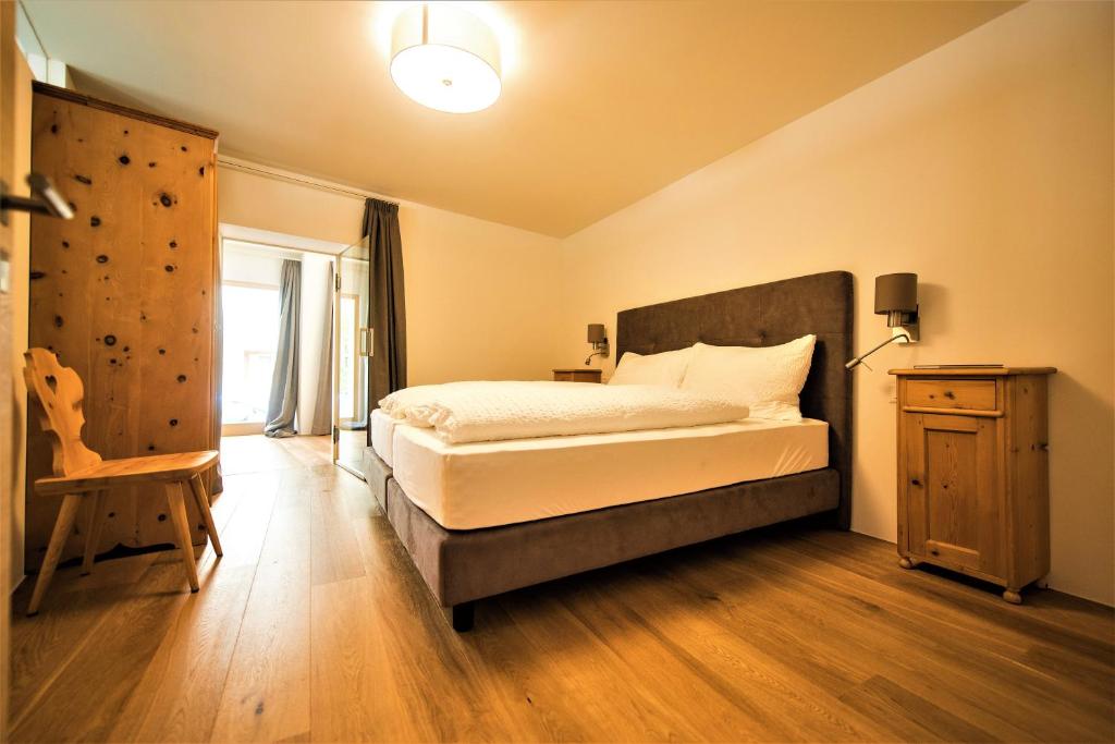 Postel nebo postele na pokoji v ubytování Hotel Münsterhof