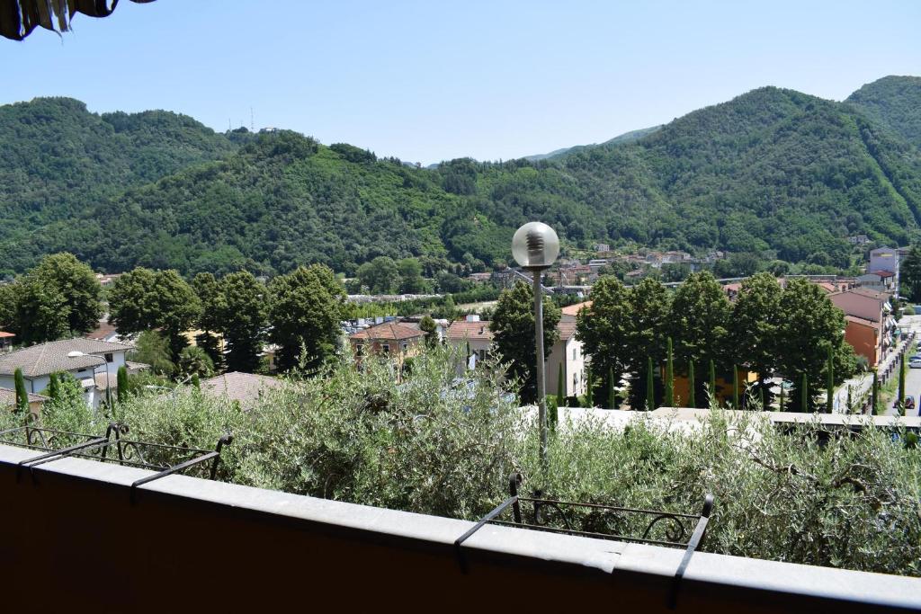 a view of a city with mountains in the background at Casa Daniela in Bagni di Lucca