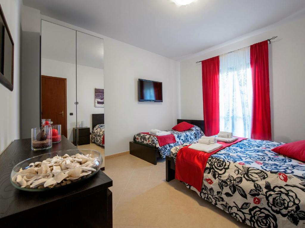 Łóżko lub łóżka w pokoju w obiekcie B&B La Casetta