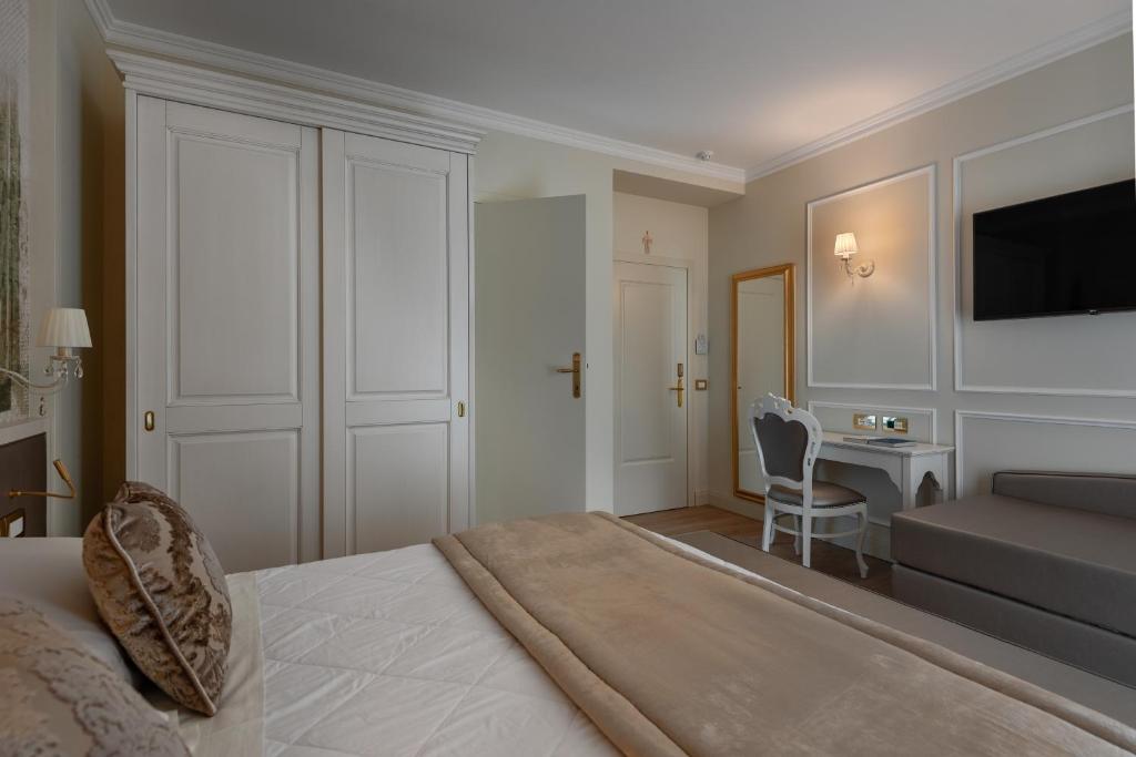 Кровать или кровати в номере Hotel Ca' D'Oro Tre Stelle Superior Adults only