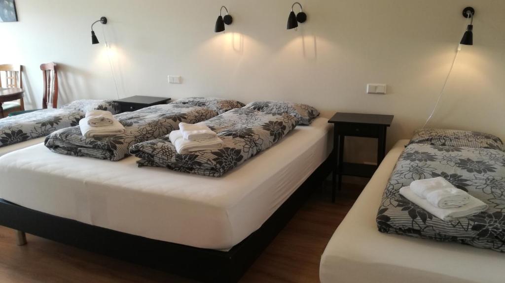 Postel nebo postele na pokoji v ubytování Guesthouse Storu-Laugar