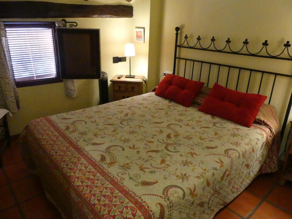 Postel nebo postele na pokoji v ubytování Hotel Posada del Adarve