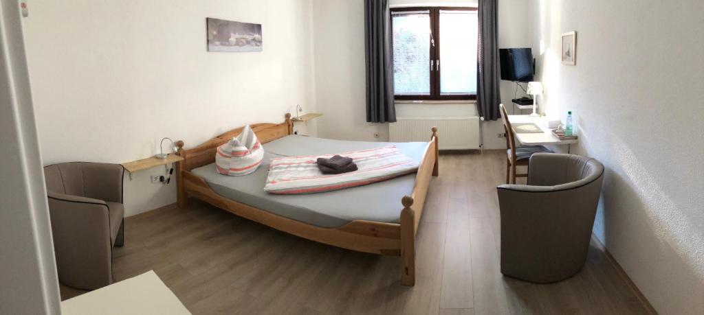 Postel nebo postele na pokoji v ubytování Hotel am Weißdornbusch