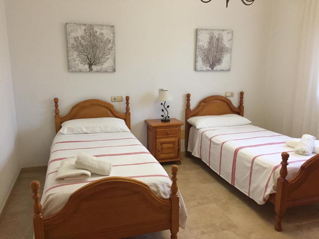 A bed or beds in a room at Es Lliri Blanc