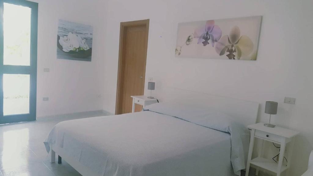 Katil atau katil-katil dalam bilik di Hotel Falco D'oro