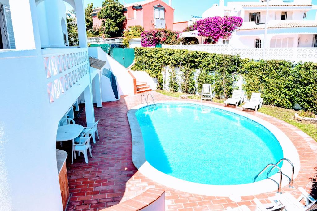 a swimming pool on the balcony of a hotel at Albufeira Elegance in Albufeira