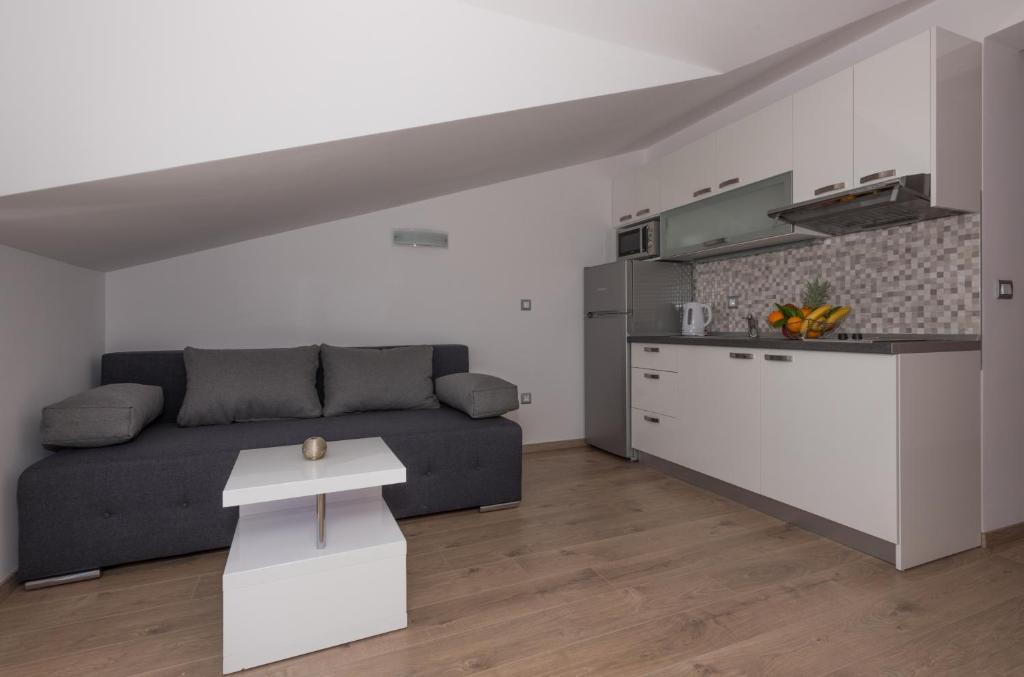 Kuchyňa alebo kuchynka v ubytovaní APARTMANI VUJČIĆ