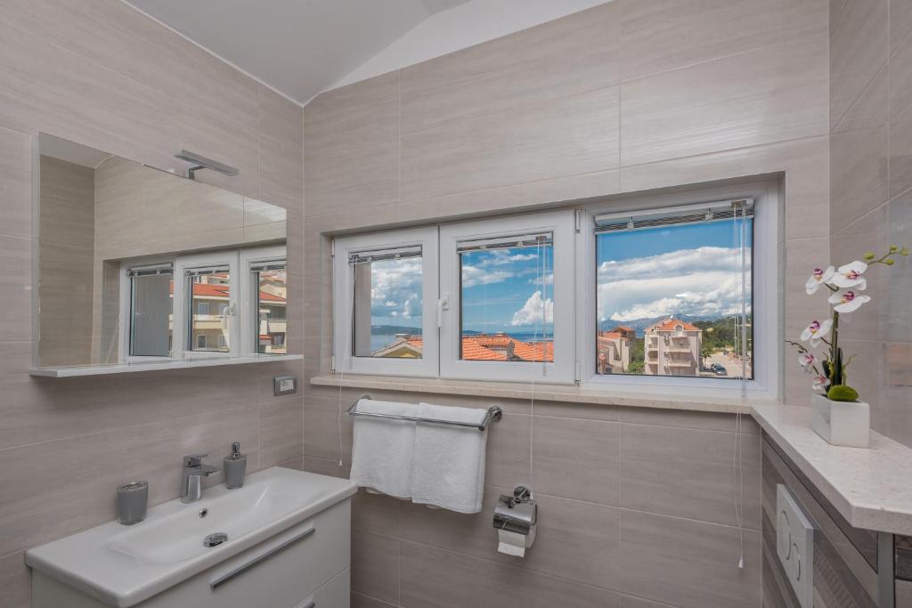 Kúpeľňa v ubytovaní APARTMANI VUJČIĆ