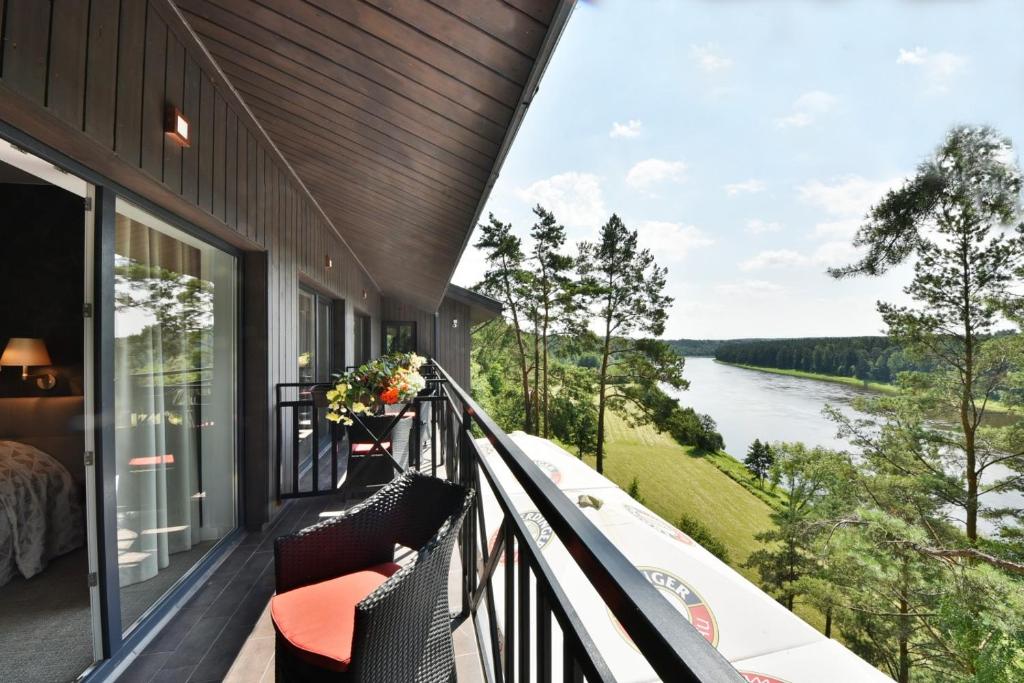 a balcony with a view of a river at "Seklytele" apartments in Birštonas
