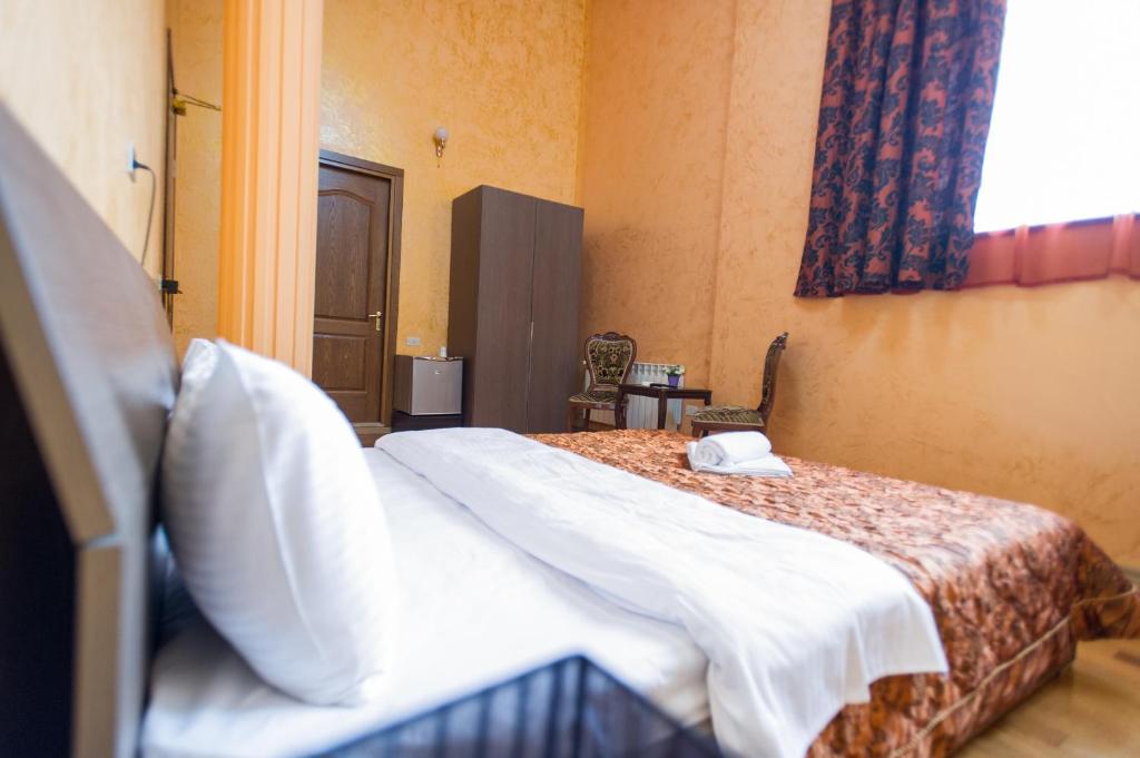 Postel nebo postele na pokoji v ubytování hotel amber