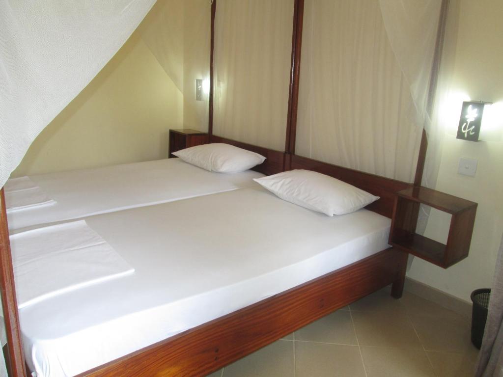 Postel nebo postele na pokoji v ubytování Tandem Guesthouse