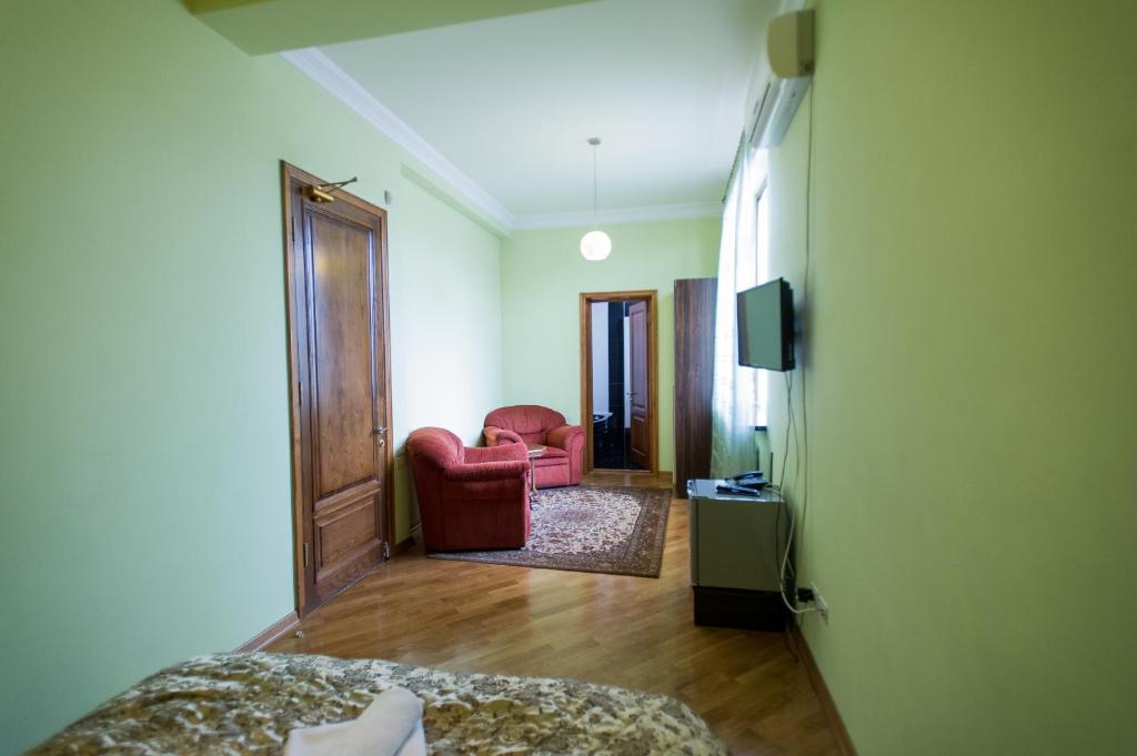 TV a/nebo společenská místnost v ubytování hotel amber