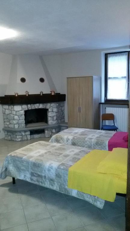 Postel nebo postele na pokoji v ubytování La Fisarmonica