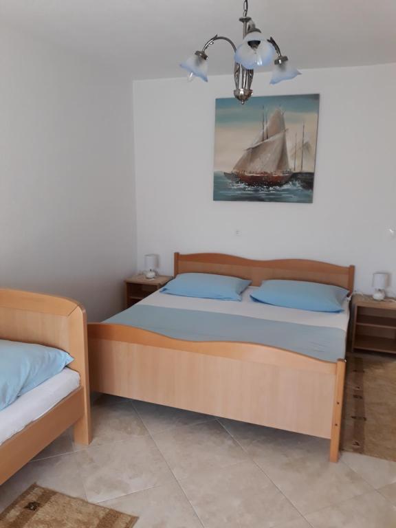 Postel nebo postele na pokoji v ubytování Apartmani Tanja